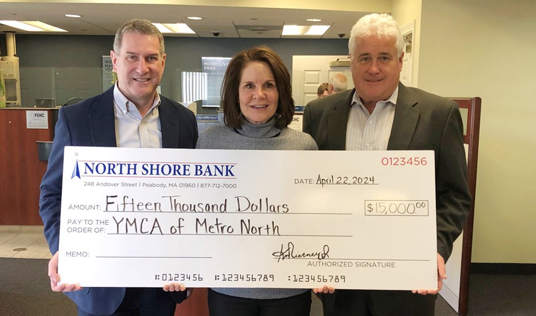 Photograph of North Shore Bank making a $15,000 contribution to the YMCA of Metro North