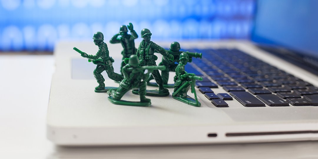 Image of toy soldiers protecting a laptop