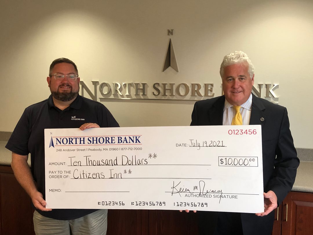 Photo of North Shore Bank presenting Citizens  Inn with a contribution