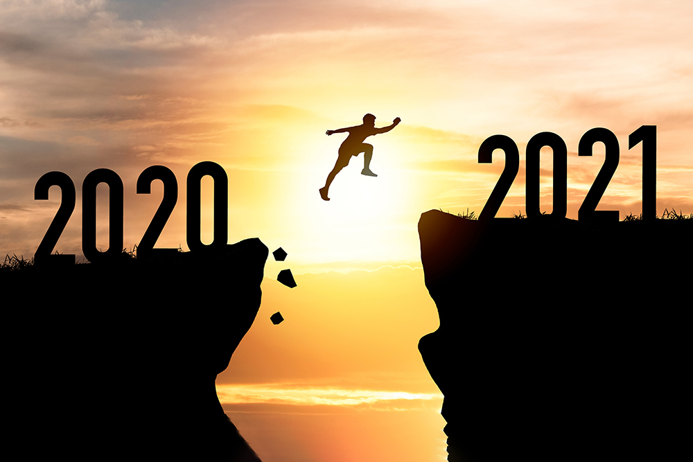Year-End Financial Planning concept - man jumping across a chasm