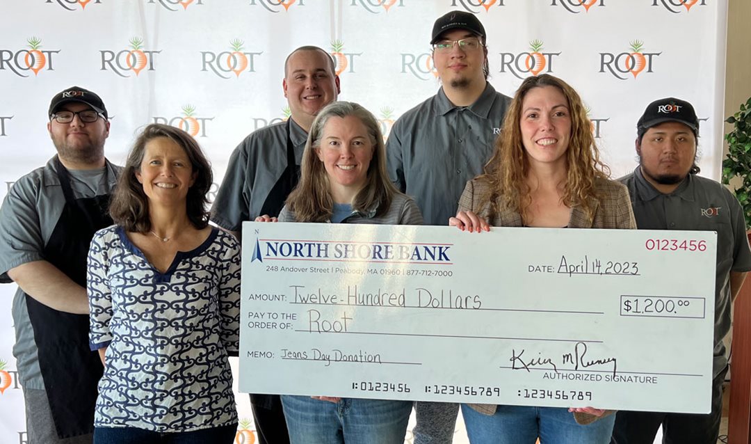 Photo of North Shore Bank presenting Root with a $1,200 Jeans Day check.