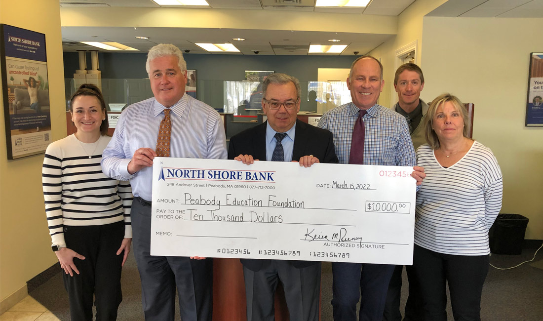 Photo of North Shore Bank presenting a $10,000 donation to the Peabody Education Foundation Mental Wellness Initiative