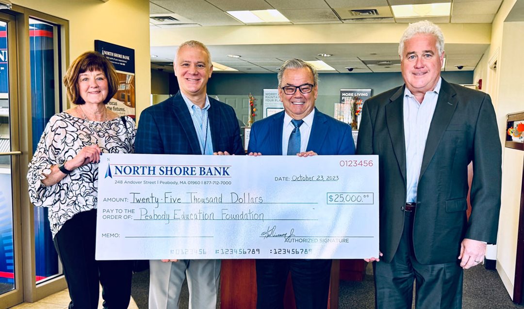 Photo of North Shore Bank presenting a $25,000 contribution to the Peabody Education Foundation Mental Wellness Initiative