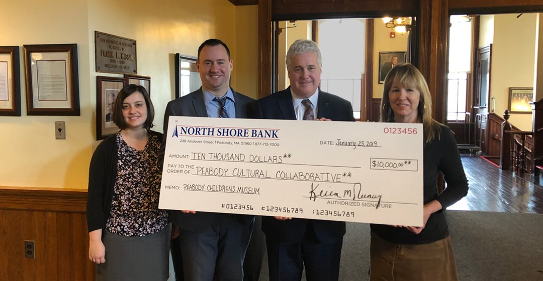 North Shore Bank presents a check for $10,000 to sponsor Peabody's future Pop-Up Children's Museum.