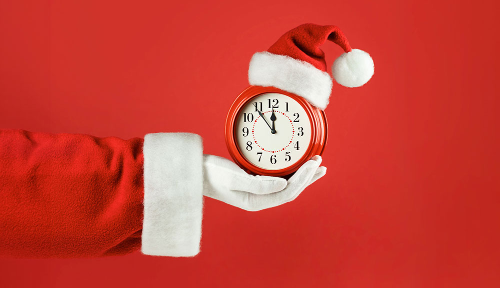 North Shore Bank Holiday Hours - Santa Holding a Clock