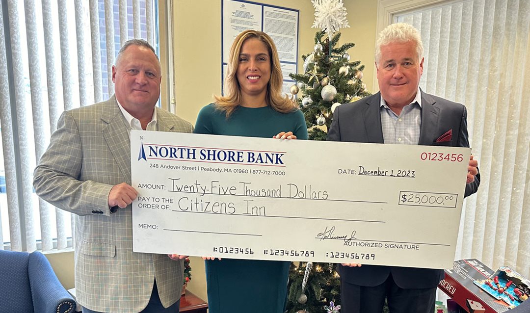 Photo of North Shore Bank presenting a $25,000 contribution to the Citizens Inn Inn Transition Program