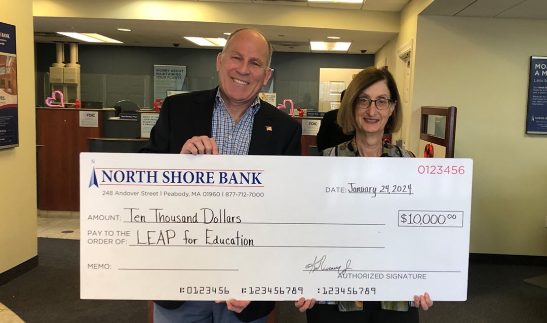 Photo of North Shore Bank presenting LEAP for Education with donation for their Great Expectations Gala.