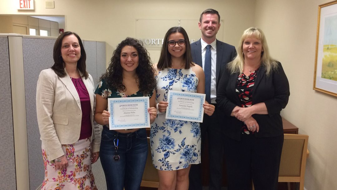 Image of NSB personnel presenting scholarships to Saugus High School students