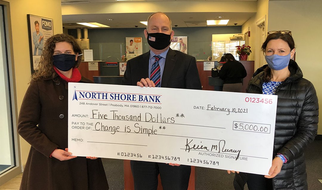 Photo of North Shore Bank's $5.000 contribution to Change is Simple to help educate children on environmental sustainability.