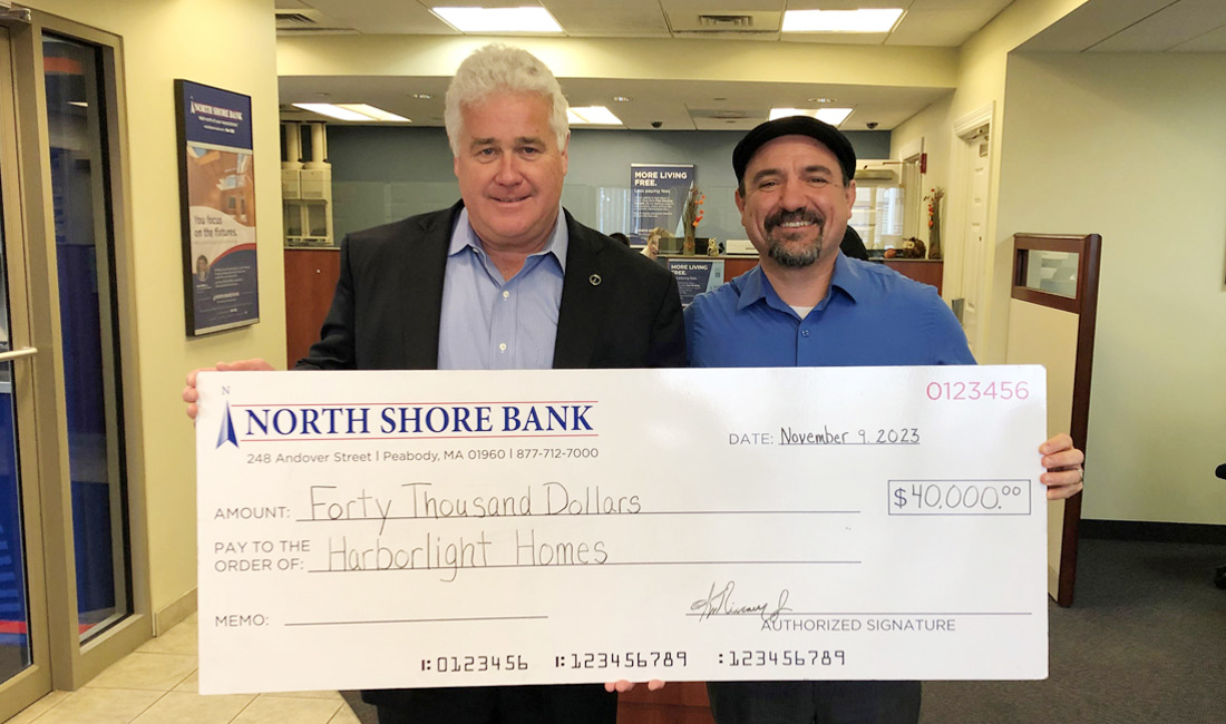 Photo of NSB presenting a check to Harborlight Homes in support of their mission of affordable housing