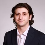 A headshot of Marco Maglio.