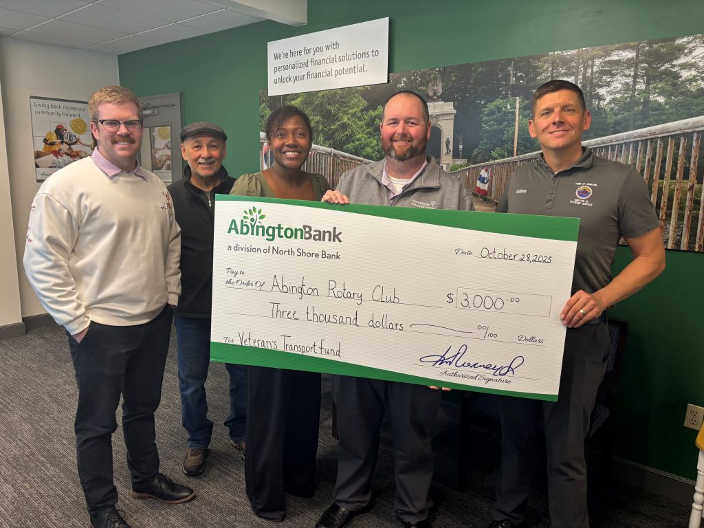 A check presentation for a donation to local veterans.